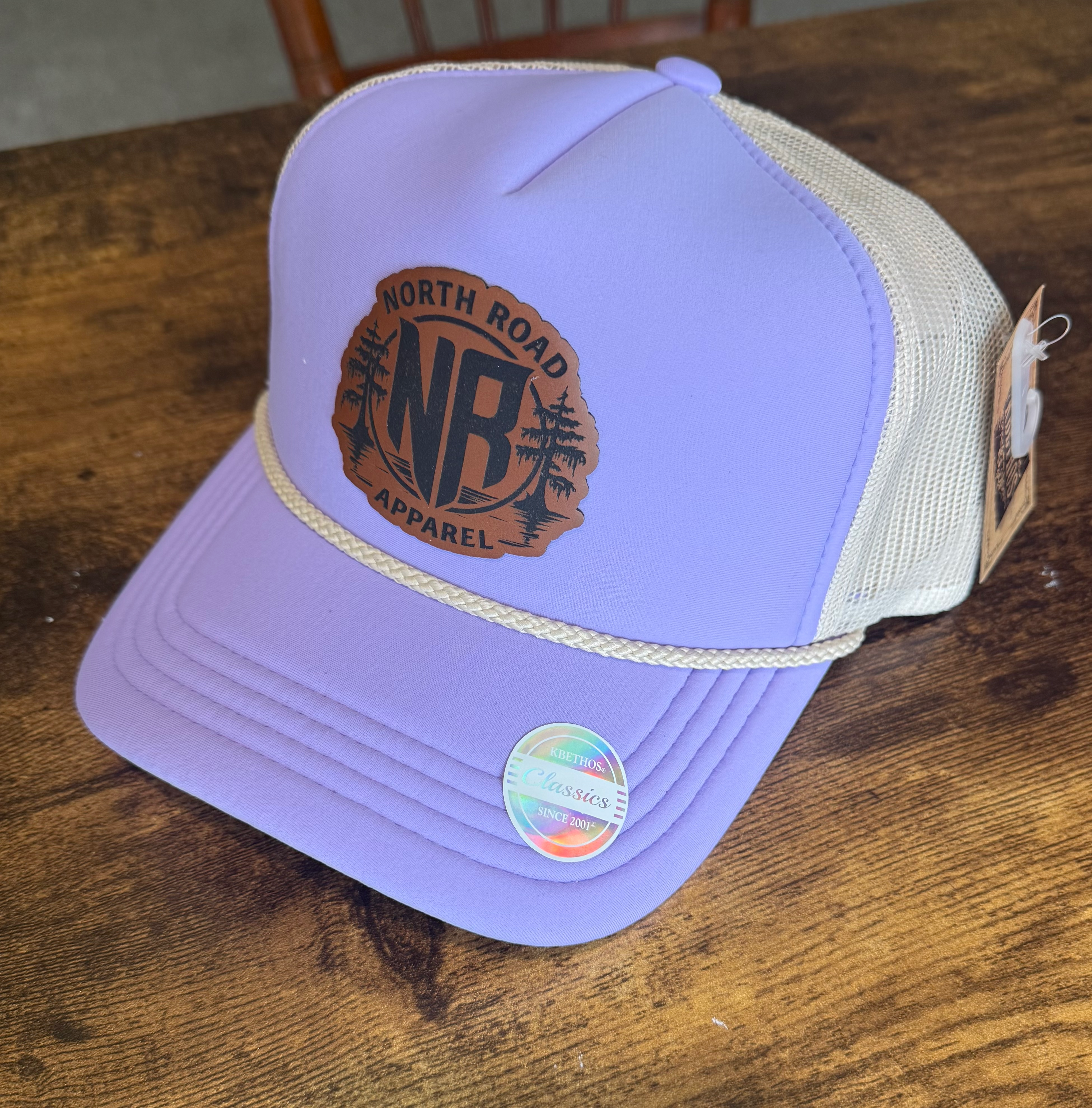 Women’s purple rope hat with leather patch